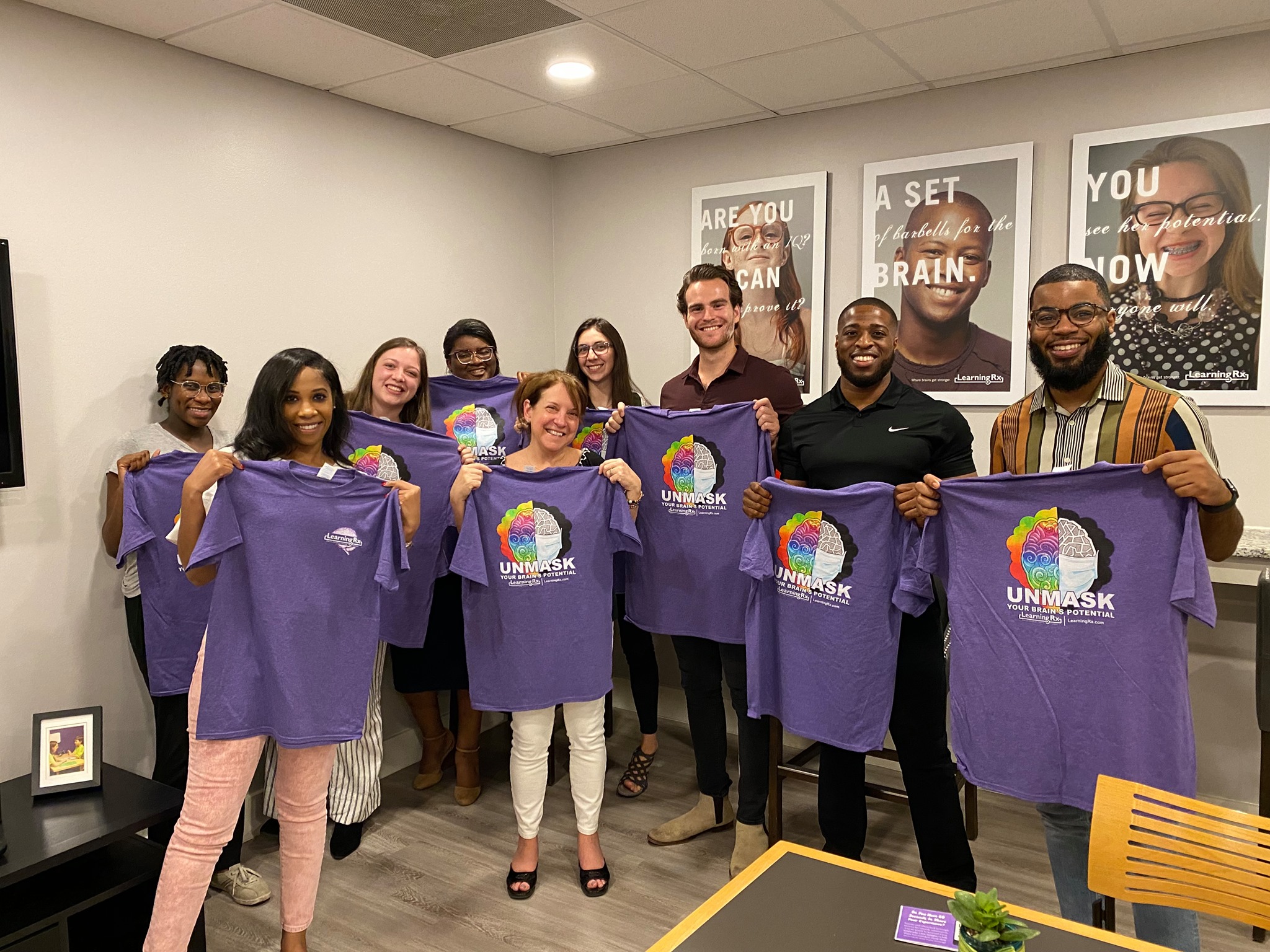 Susie and her staff with Brain Trainer shirts